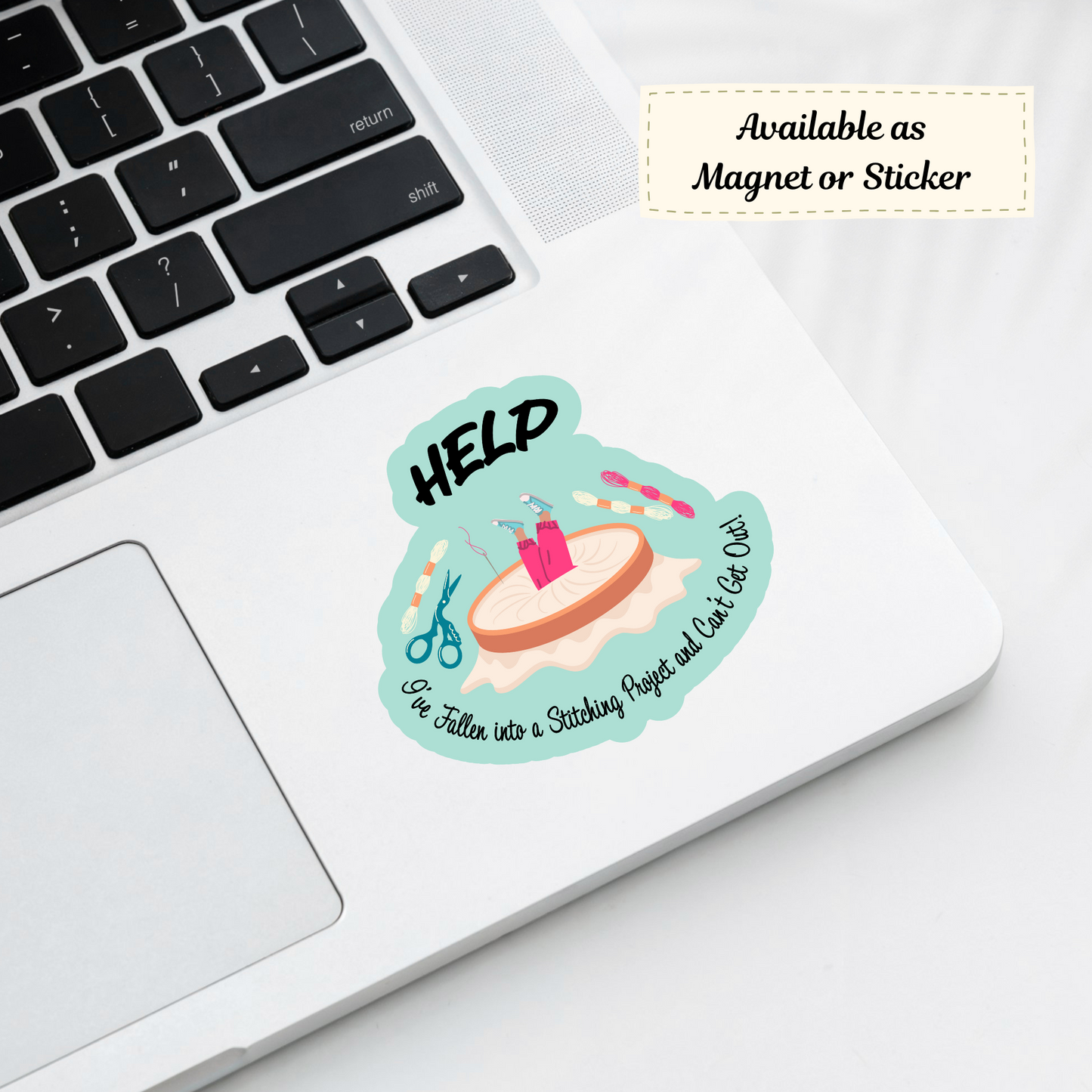 Laptop with “Help I’ve Fallen Into a Stitching Project” sticker, funny craft design visible