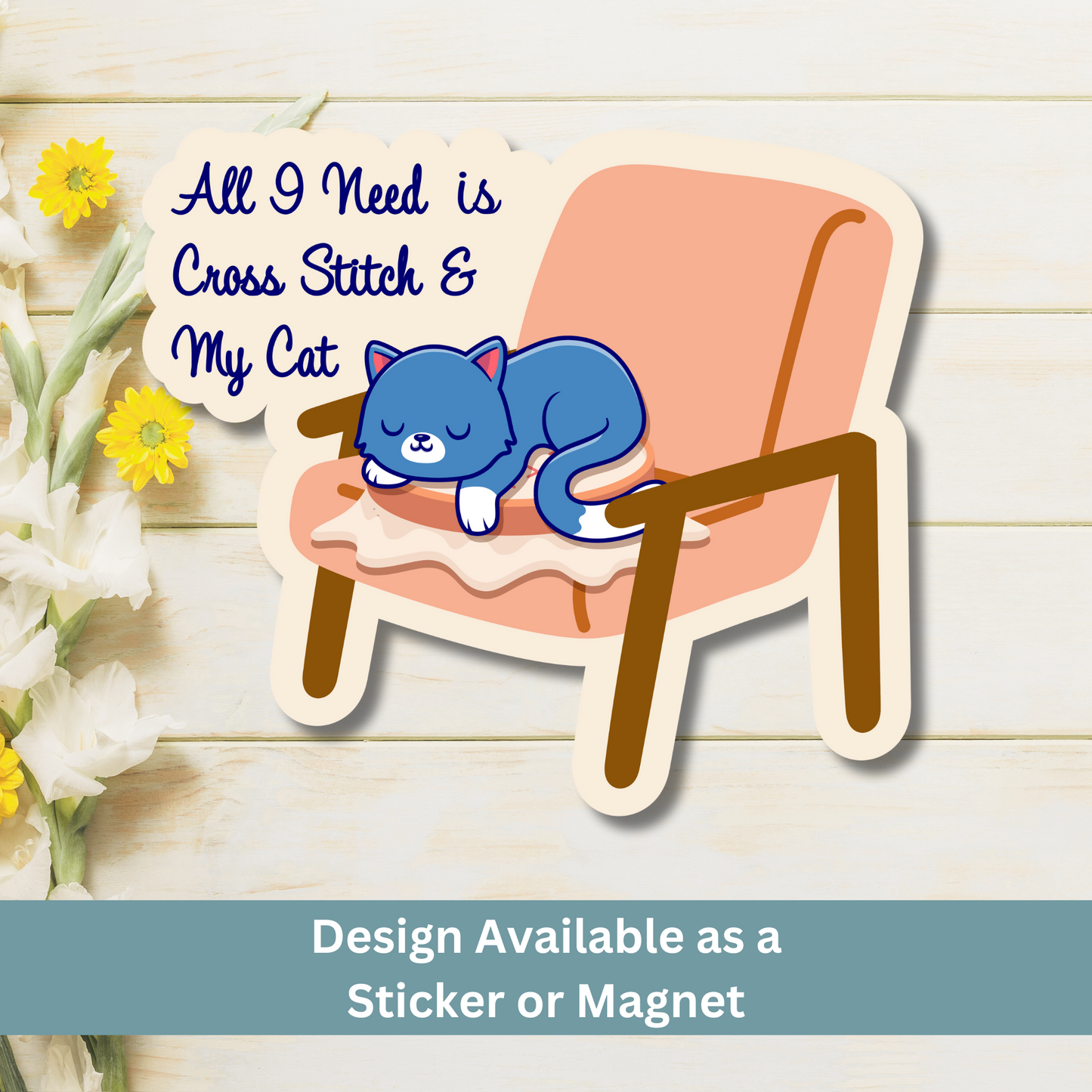 Magnet of cat and cross stitch design on wood flat lay