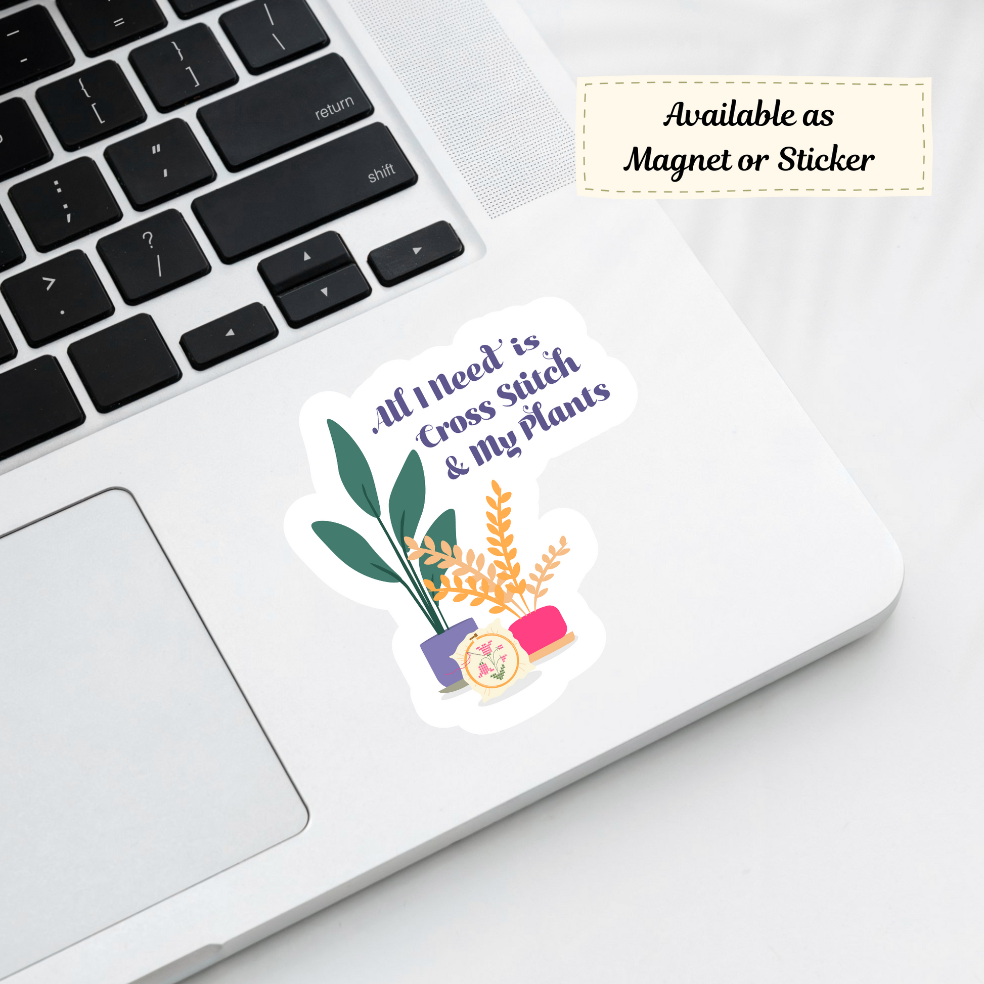 Cross-stitch and plants themed sticker on laptop corner, cozy crafting vibe