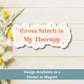 Flat lay image of calming cross-stitch quote magnet on wood plank background