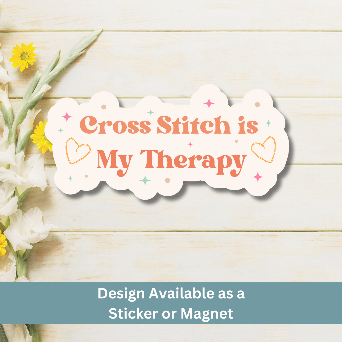 Decorative magnet with 'Cross Stitch is My Therapy' text on a wooden background with flowers.