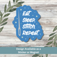 Sticker of “Eat. Sleep. Stitch. Repeat.” on whitewashed wood background