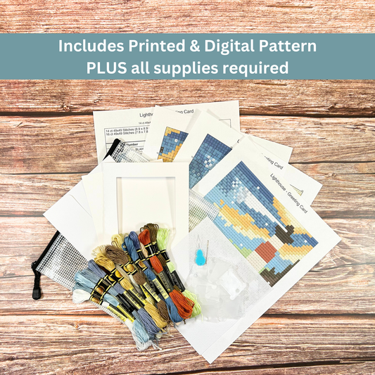 Complete cross-stitch kit for a lighthouse greeting card, including printed pattern, threads, needle, and aperture card.