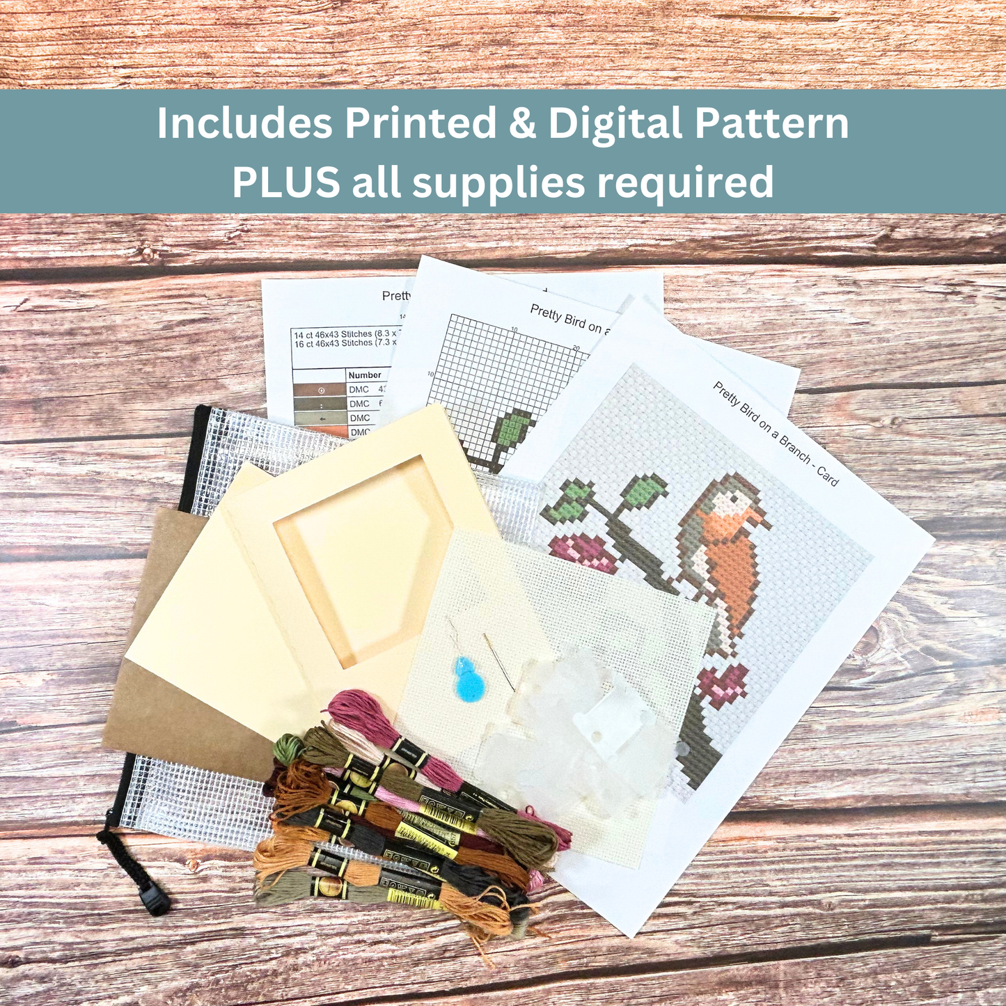 Complete cross-stitch kit including Aida cloth, embroidery floss, pattern sheets, and greeting card materials.