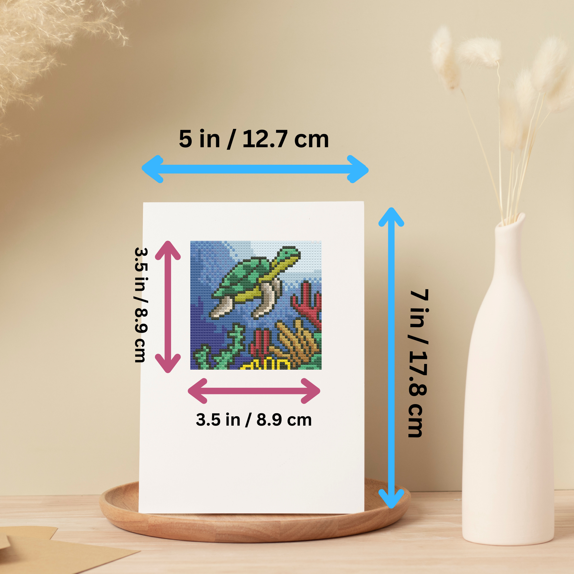 Complete cross-stitch kit contents, including pattern, embroidery floss, Aida cloth, pre-folded card, envelope, and accessories.